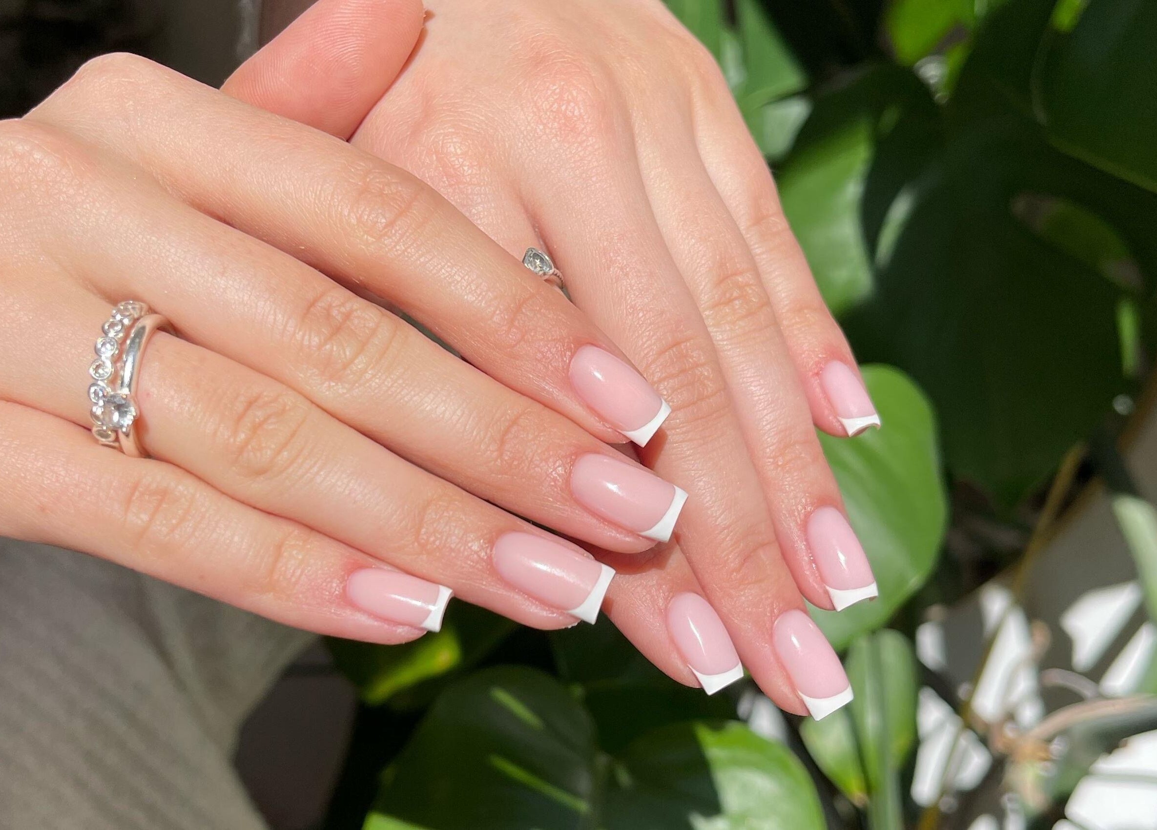Elegant French manicure by LMS Nails in Glasgow, Scotland, GB. Perfectly polished pink nails with white tips.