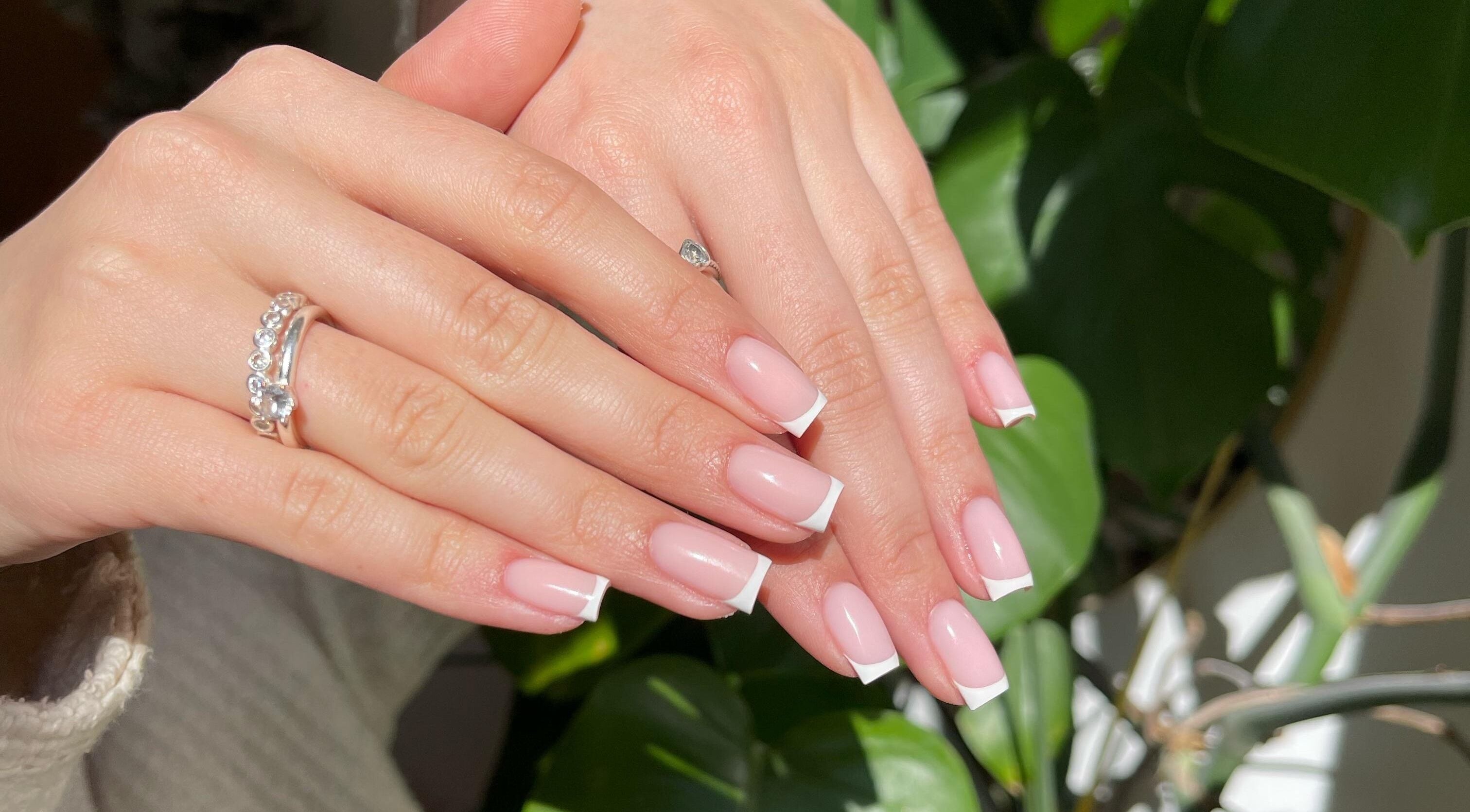 Elegant French manicure by LMS Nails in Glasgow, Scotland, GB. Perfectly polished pink nails with white tips.