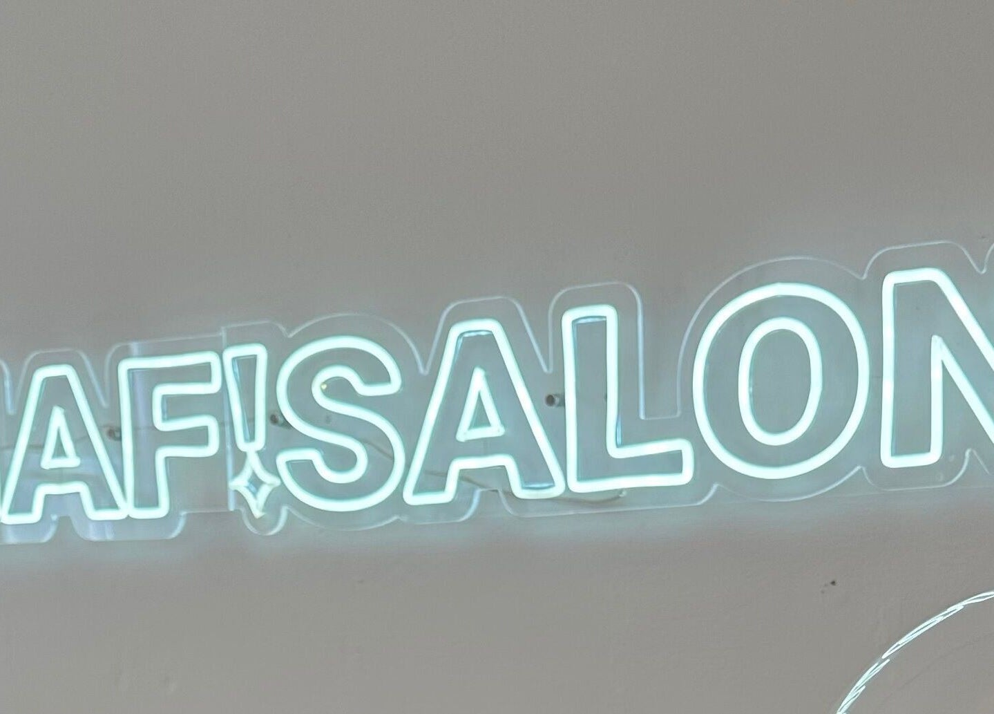 Neon salon sign at LMS Nails, Glasgow, Scotland, GB, showcasing a modern and stylish interior vibe.
