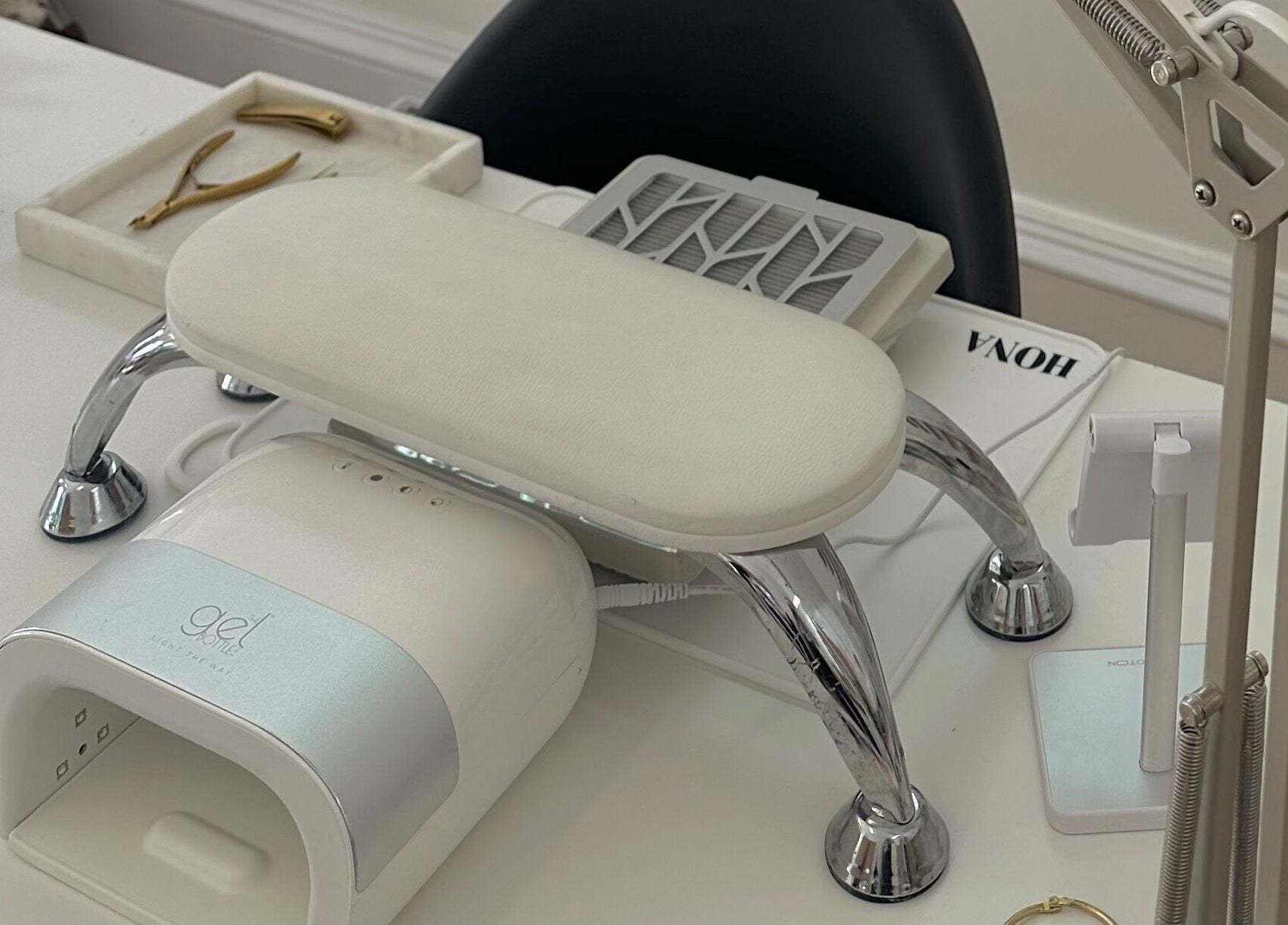 Modern nail station setup at LMS Nails, Glasgow, Scotland, GB featuring tools and gel dryer.