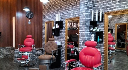 Franks Mens Salon in Dubai, Dubai, AE, featuring retro barber chairs and elegant mirrors.