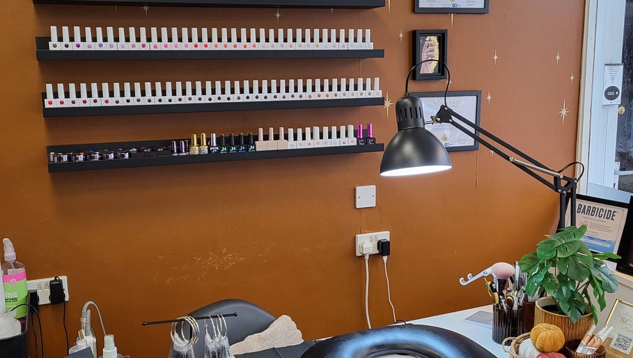 Boho Glow Nails workspace in Launceston, England, GB featuring a modern nail polish display.