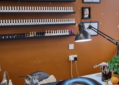 Boho Glow Nails workspace in Launceston, England, GB featuring a modern nail polish display.