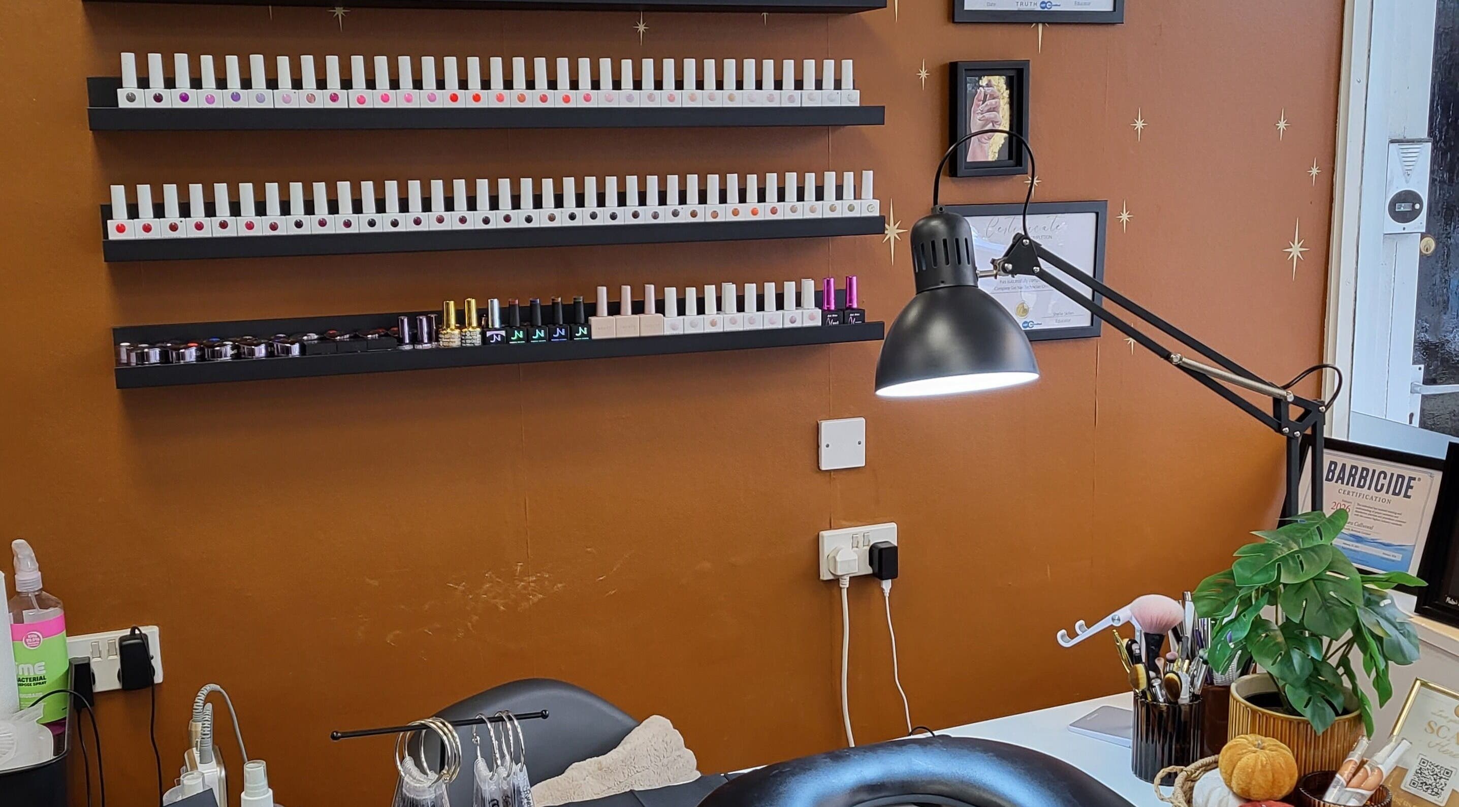 Boho Glow Nails workspace in Launceston, England, GB featuring a modern nail polish display.