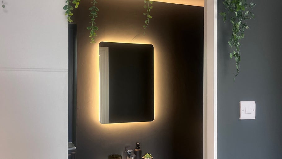Elegant backlit mirror at Rebecca Louise Beauty, Culcheth, England, GB enhances modern aesthetic.