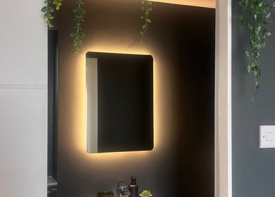 Elegant backlit mirror at Rebecca Louise Beauty, Culcheth, England, GB enhances modern aesthetic.