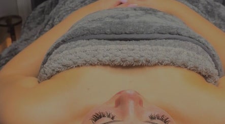 Relaxing spa treatment at Rebecca Louise Beauty, Culcheth, England, GB, with warm towels and soothing ambiance.