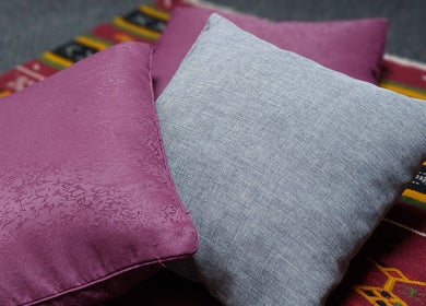 Cozy cushions on vibrant rug at City Zen Sanctuary, Edinburgh, Scotland, GB create a calming ambiance.