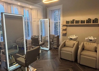 Luxurious styling chairs and wash stations at Croftpark House Spa, Airdrie, Scotland, GB blend elegance and comfort.