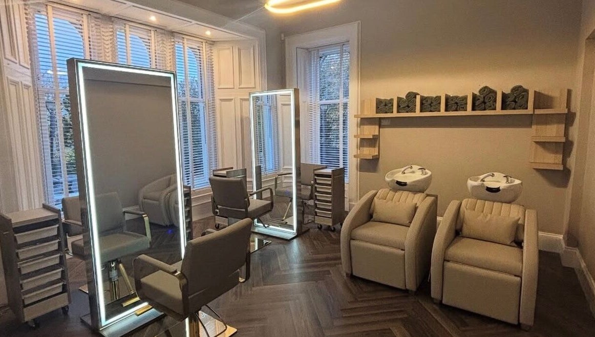 Elegant salon at Croftpark House Spa in Airdrie, Scotland, GB with modern chairs and washbasins.