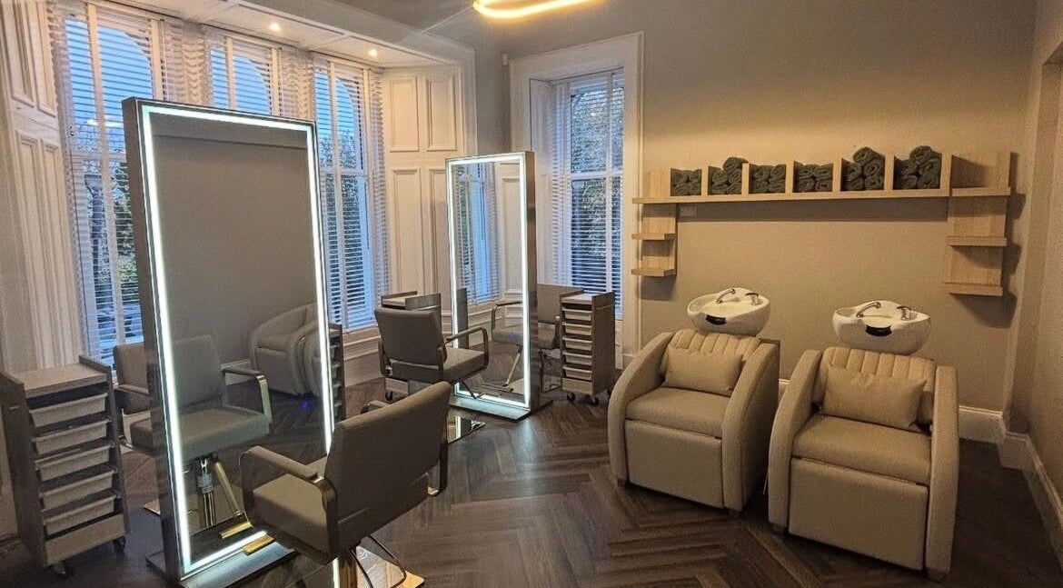 Elegant salon at Croftpark House Spa in Airdrie, Scotland, GB with modern chairs and washbasins.