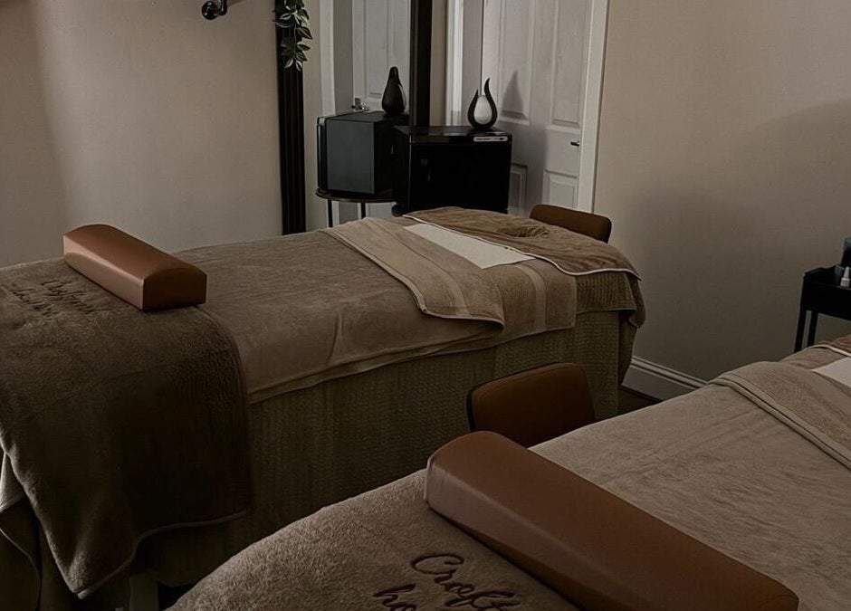 Relaxing massage room at Croftpark House Spa, Airdrie, Scotland, GB, featuring cozy twin beds.