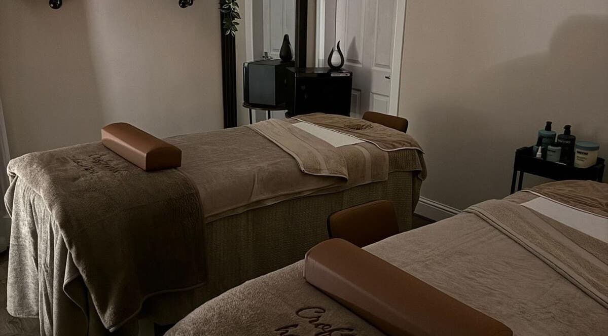 Relaxing massage room at Croftpark House Spa, Airdrie, Scotland, GB, featuring cozy twin beds.