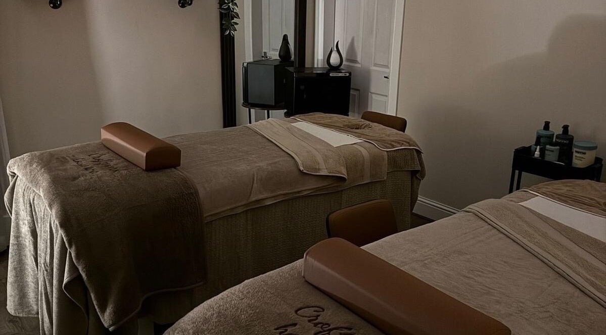 Relaxing massage room at Croftpark House Spa, Airdrie, Scotland, GB, featuring cozy twin beds.