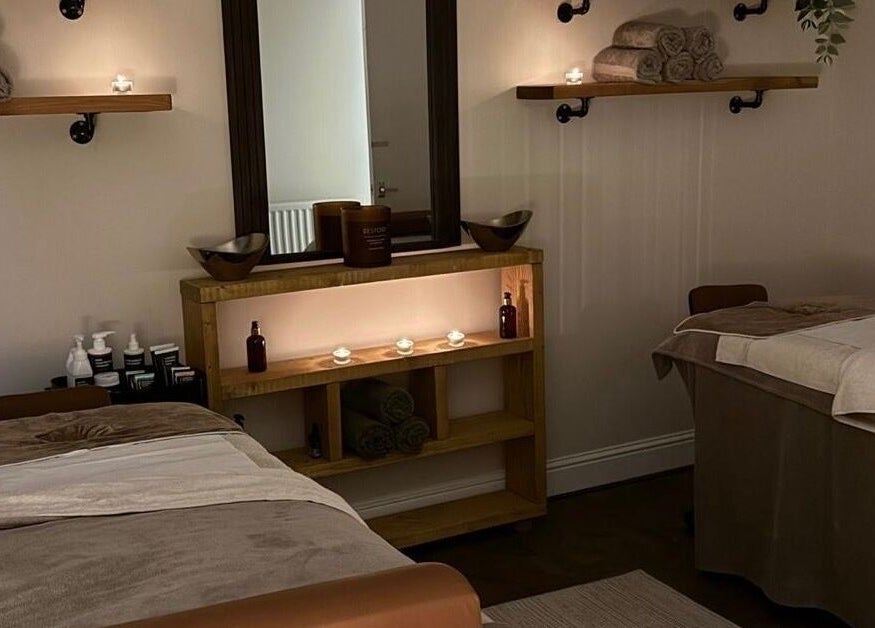 Elegant treatment room at Croftpark House Spa, Airdrie, Scotland, GB, featuring cozy beds and calming décor.