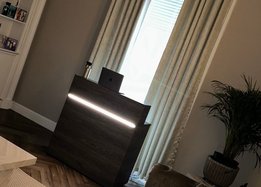 Elegant reception area at Croftpark House Spa in Airdrie, Scotland, GB featuring modern décor and lush plants.