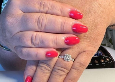 Freshly manicured red nails at Bella Beauty & Nails, Banbridge, Northern Ireland, GB, showcasing elegant style.