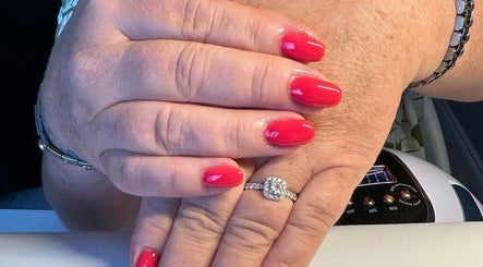 Freshly manicured red nails at Bella Beauty & Nails, Banbridge, Northern Ireland, GB, showcasing elegant style.