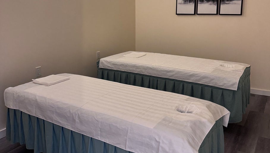Two massage tables in the tranquil setting of OMI MASSAGE, Lawrenceville, Georgia, US.
