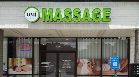 Exterior view of OMI MASSAGE in Lawrenceville, Georgia. Welcoming entrance with bright sign.