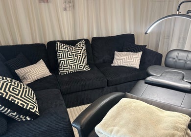 Cozy seating and treatment chair at Ink & Lam, London, England, GB for a relaxing beauty experience.