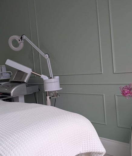 Tranquil treatment room at Skinology, Shenley Lodge, England, GB with modern equipment and elegant decor.