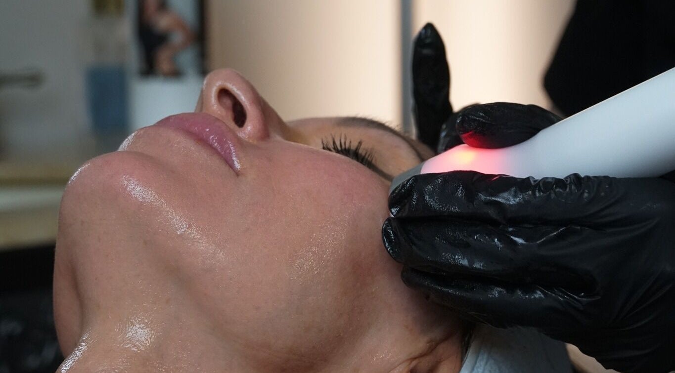 Facial treatment at Renew Spa & Fitness, Manhattan, Kansas, US, enhancing skin radiance.