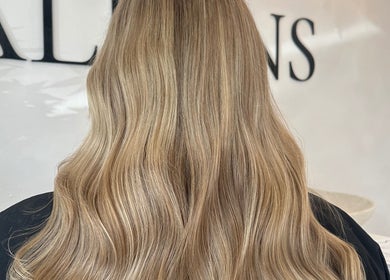 Blonde wavy hairstyle at Hair By Macey Coles, Clifton, England, GB. Elegant salon styling.