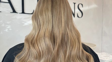 Blonde wavy hairstyle at Hair By Macey Coles, Clifton, England, GB. Elegant salon styling.