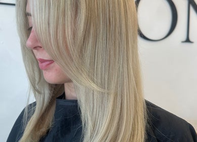 Sleek blonde hairstyle at Hair By Macey Coles, Clifton, England, GB.