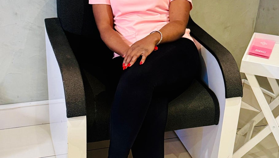 Seating area at Nails_byprim, Sandton, Gauteng, ZA showcasing elegant black chair and stylish decor.