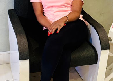 Seating area at Nails_byprim, Sandton, Gauteng, ZA showcasing elegant black chair and stylish decor.