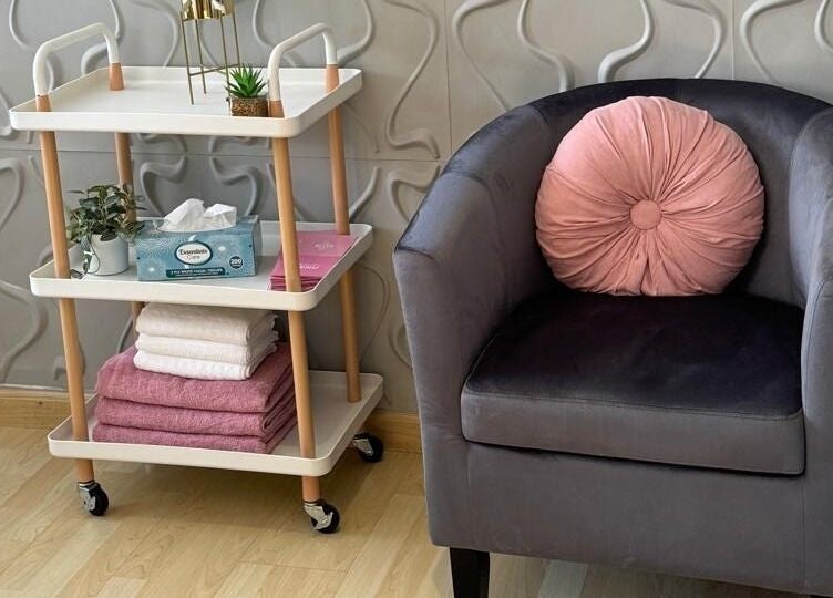 Relaxing corner at Nails By Prim, Sandton, Gauteng, ZA with plush chair and elegant decor.