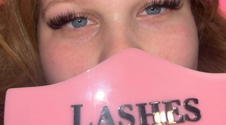 Close-up of styled lashes at Lashes by Elise, Sleaford, England, GB with pink branding sign.