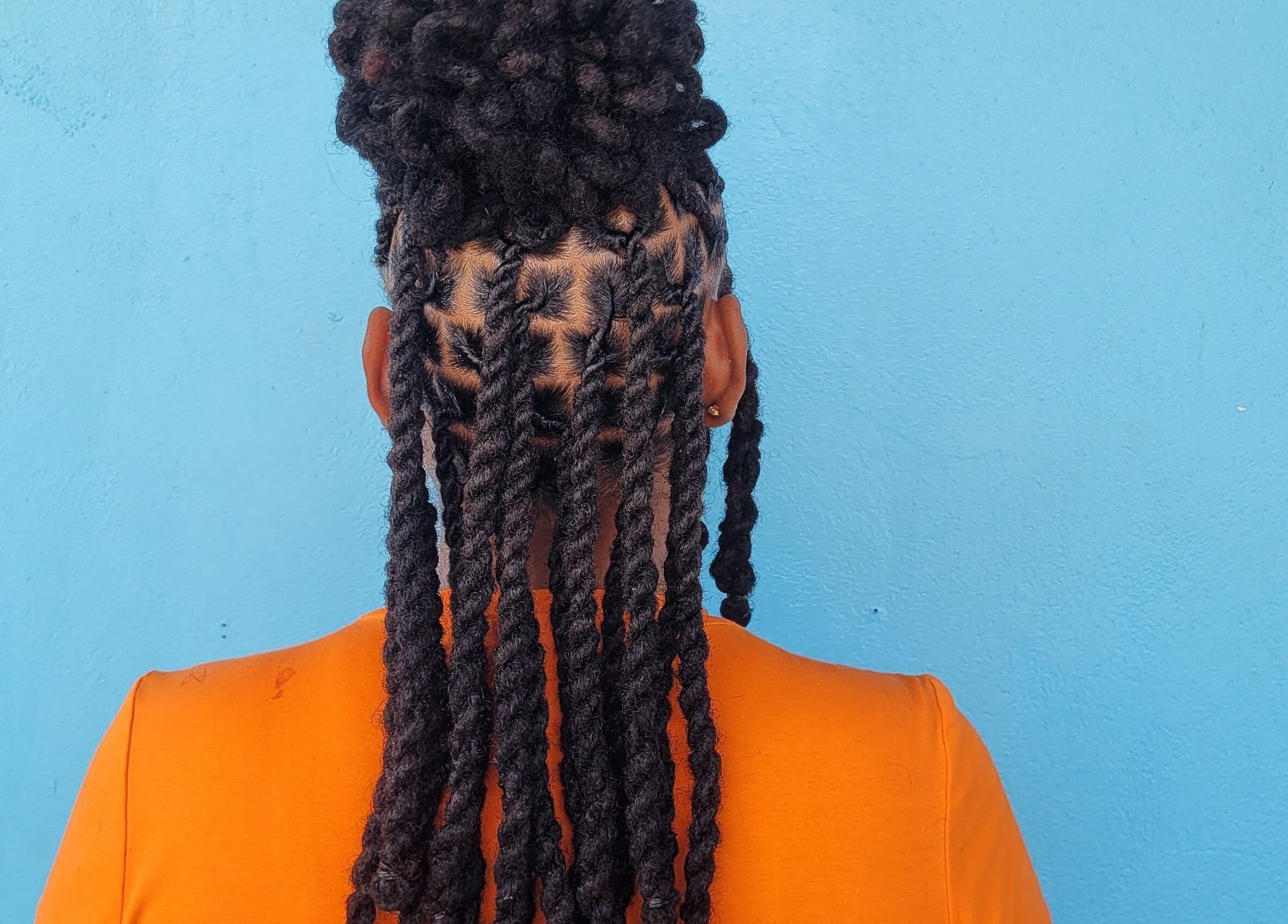 Intricate braided twists showcased at The Hair Haven, DM's top beauty salon for unique hairstyling.