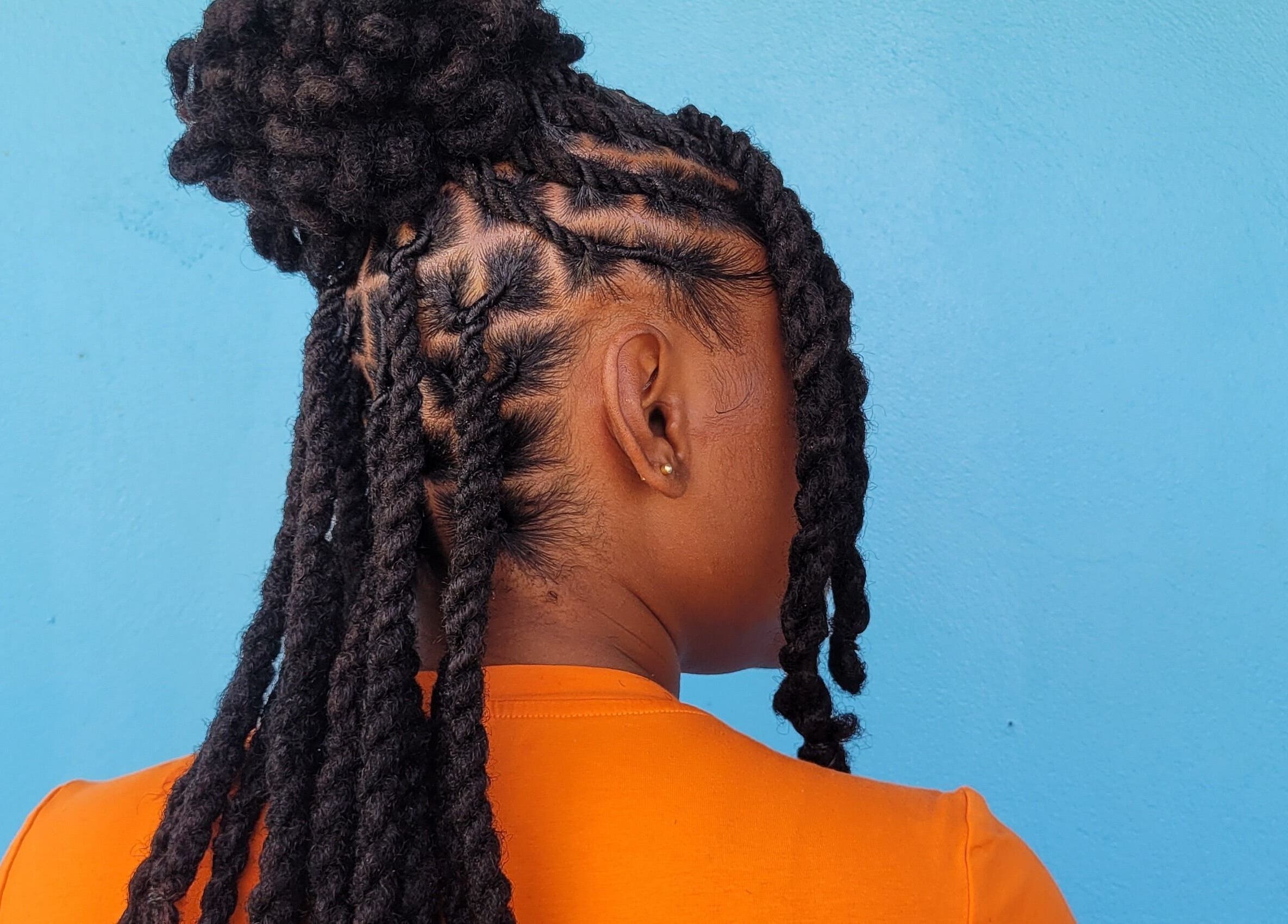Detailed twist hairstyle showcased at The Hair Haven, DM. Perfect for natural hair styling.