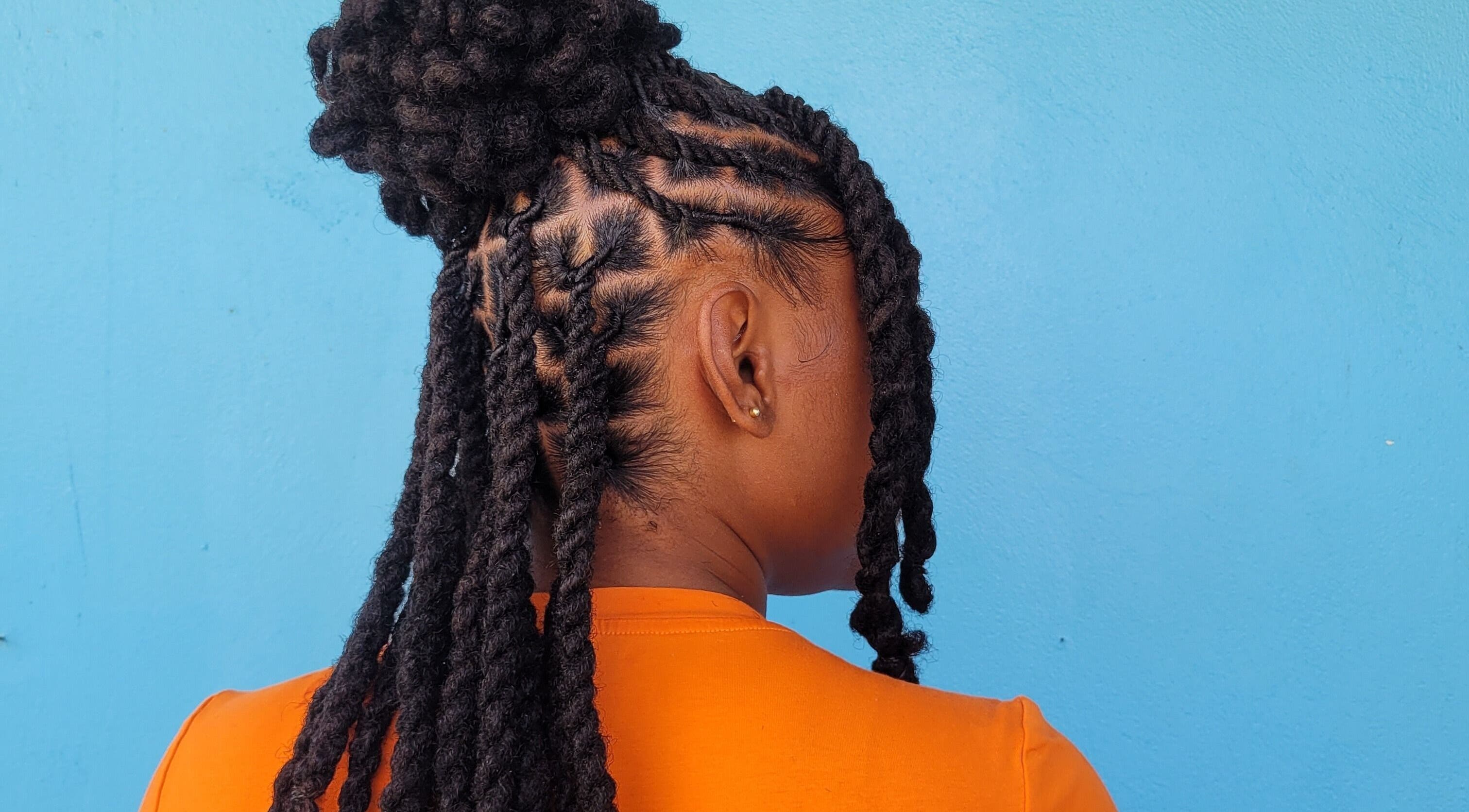Detailed twist hairstyle showcased at The Hair Haven, DM. Perfect for natural hair styling.