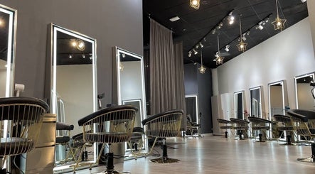 Modern interior of MopheadbyMayNoh salon in Richmond, BC, featuring elegant salon chairs and mirrors.