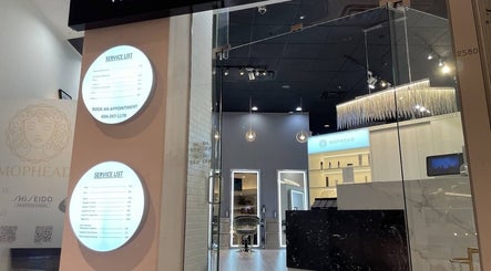 Entrance of MopheadbyMayNoh in Richmond, BC, showcasing modern decor and service list.