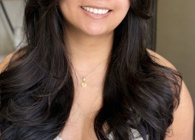 Stylish woman with glossy waves at MopheadbyMayNoh in Richmond, British Columbia, CA.