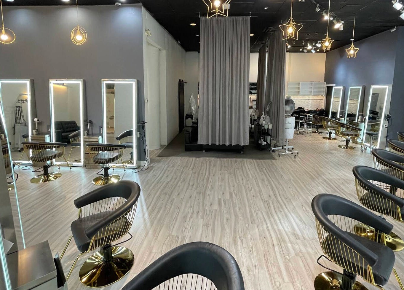 Interior of May Noh at Mophead, Richmond, British Columbia, CA, featuring chic styling stations and modern decor.