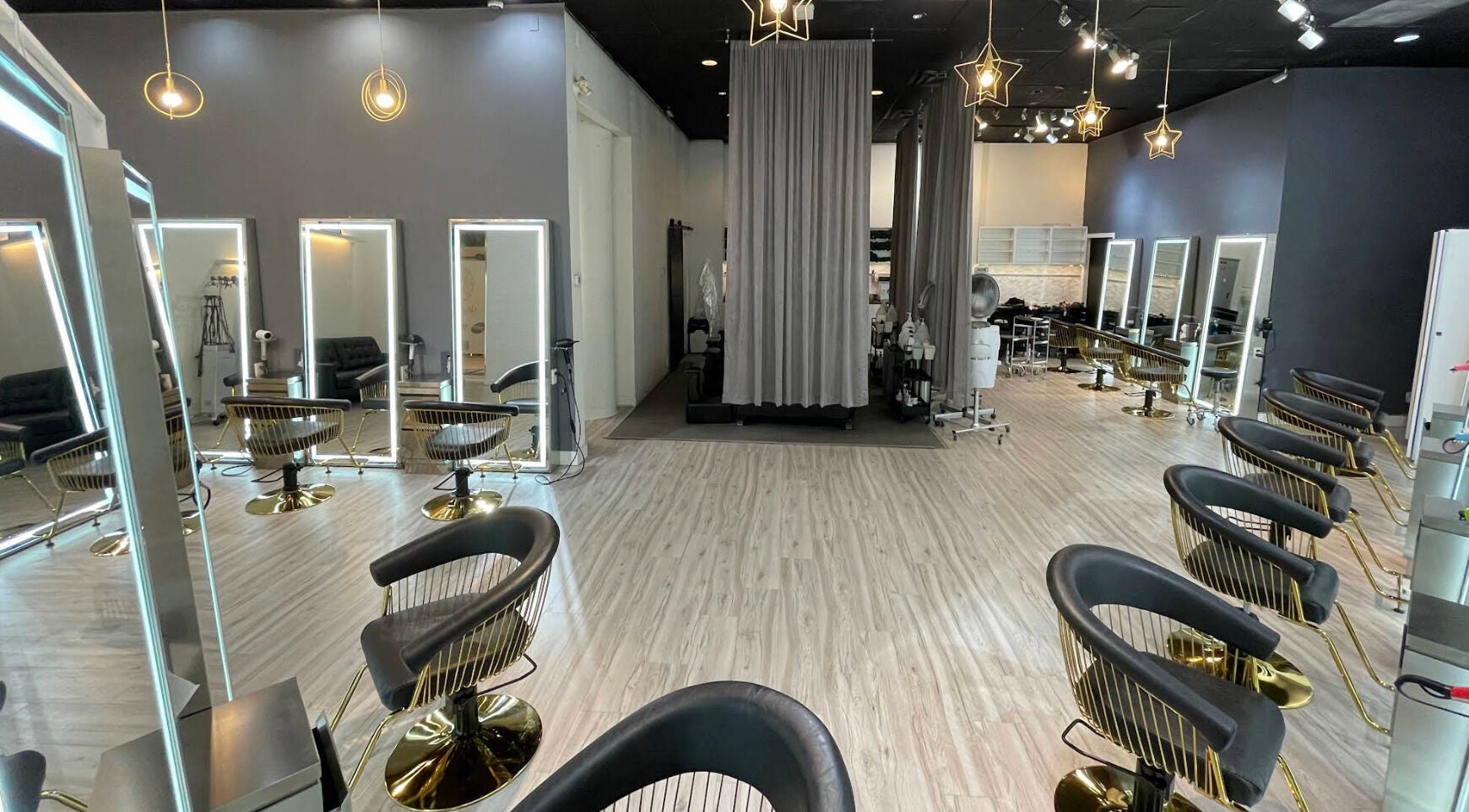 Interior of May Noh at Mophead, Richmond, British Columbia, CA, featuring chic styling stations and modern decor.