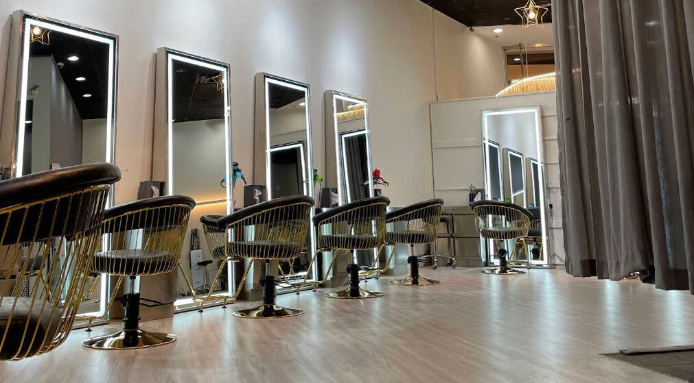 Luxurious salon interior at May Noh at Mophead in Richmond, British Columbia, CA, showcasing modern styling chairs.