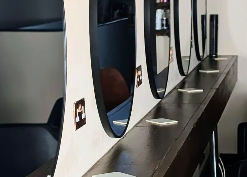 Chic salon mirrors at Danielle_TheColourRoom in Gloucester, England, GB, reflecting modern beauty style.