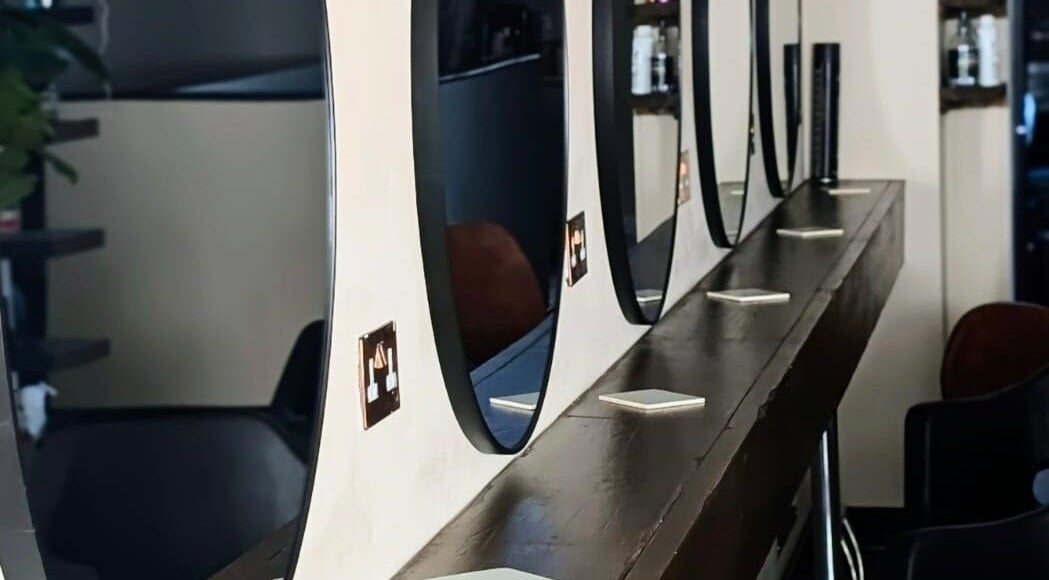 Chic salon mirrors at Danielle_TheColourRoom in Gloucester, England, GB, reflecting modern beauty style.