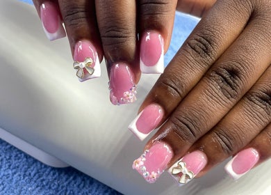 Elegant pink and white manicure with bows at Nailsbynana, Porus, Manchester Parish, JM.