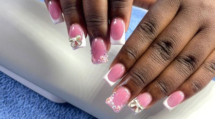 Elegant pink and white manicure with bows at Nailsbynana, Porus, Manchester Parish, JM.