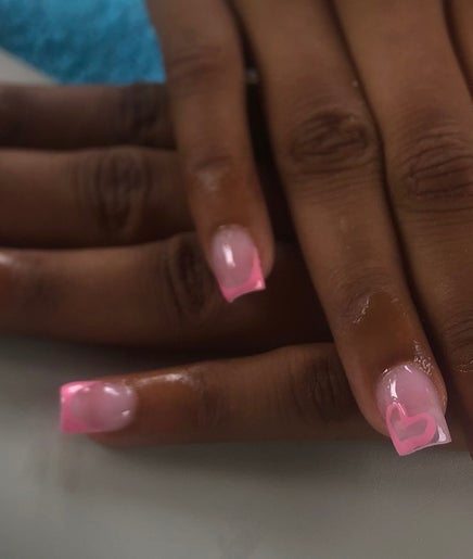 Elegant pink nail art with heart design by Nailsbynana in Porus, Manchester Parish, JM.