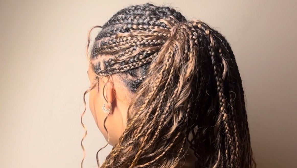 Detailed side view of braided hairstyle at Ney's Braids and Beauty, Kingsteignton, England, GB.