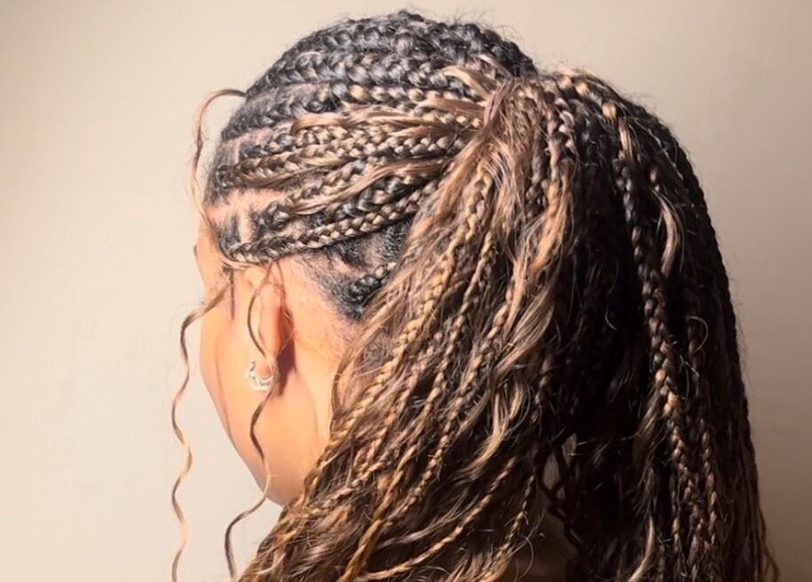 Detailed side view of braided hairstyle at Ney's Braids and Beauty, Kingsteignton, England, GB.